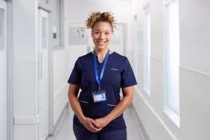 Portrait of a smiling female nurse wearing a uniform